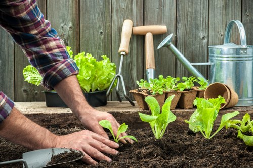 Volunteers sorting garden waste at a community recycling hub