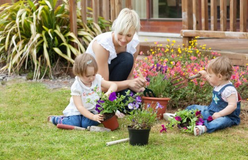 Person using a magnifier to read plant care instructions